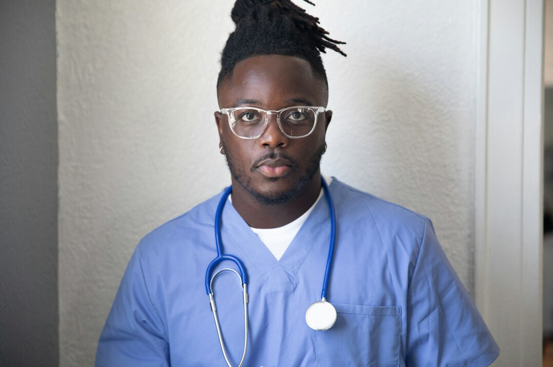 Studio portrait of a male survey methodologist wearing glasses