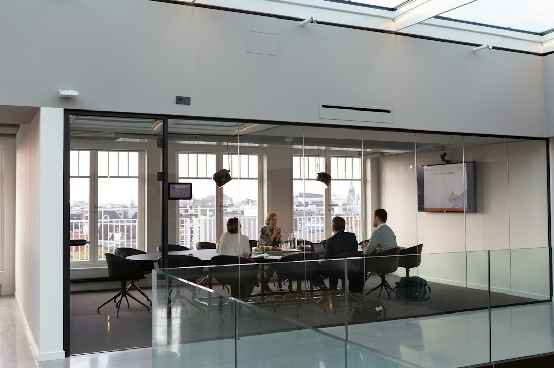 people discussing in meeting room