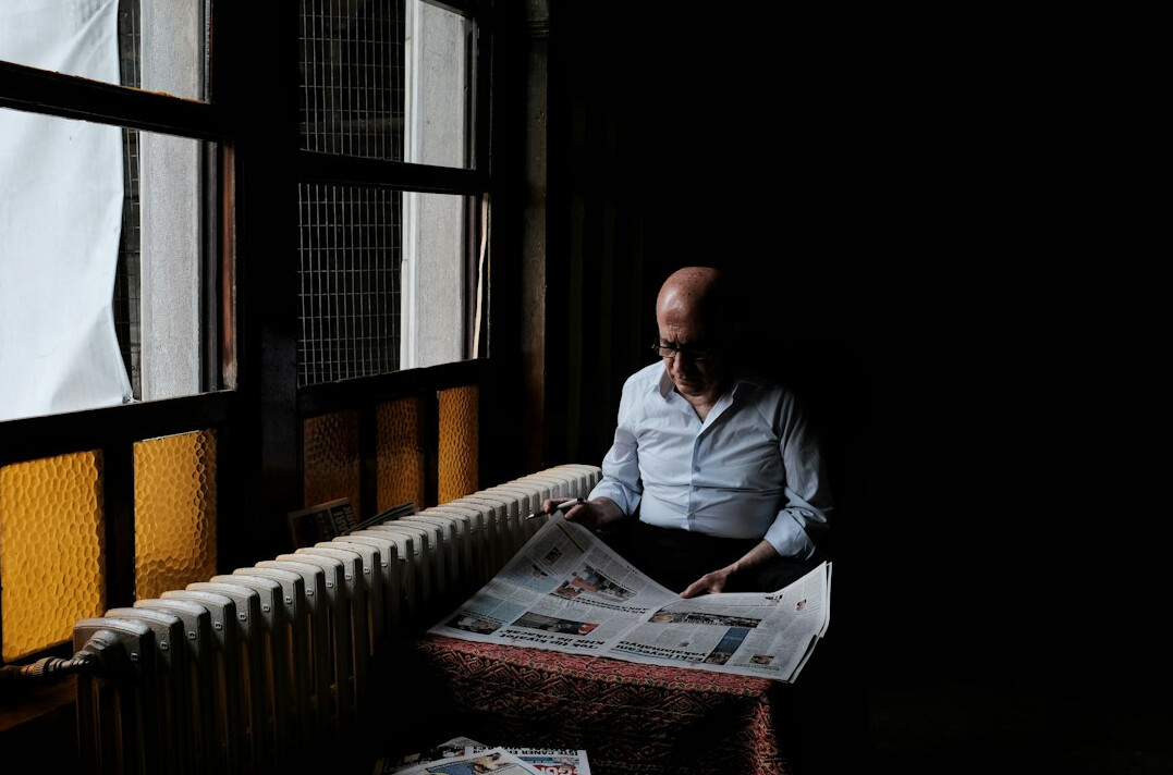 person reading news anxiously